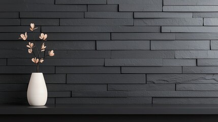 Elegant vase with blossoms against a dark wall.