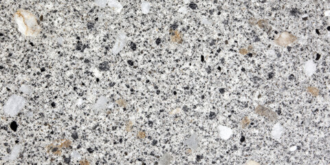 Luxurious silver and charcoal granite background with fine mineral speckles.