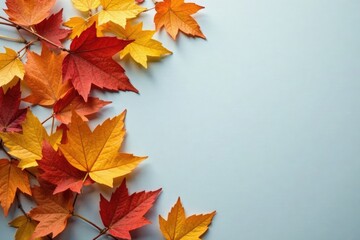 Fototapeta premium A delicate arrangement of golden and copper leaves on a soft gray surface, leafy, foliage, fall