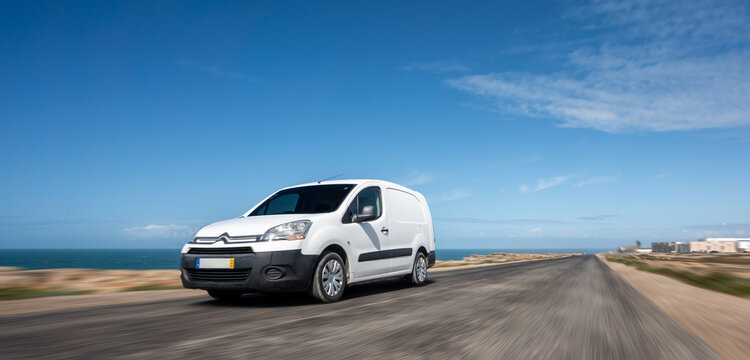 Citroen Berlingo rental car in spain mountain landscape road at sunset