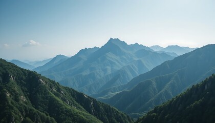 A majestic mountain range with lush green peaks, standing tall under a soft blue sky, creating a tranquil nature scene.