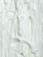 Thick and smooth vanilla gelato ice cream showcases a velvety texture, ideal for drizzling on cakes or layering in desserts during culinary preparations