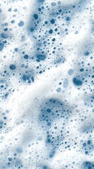 Obraz premium Bubbles and foam create an abstract blue and white pattern depicting flowing water in a serene and calming setting