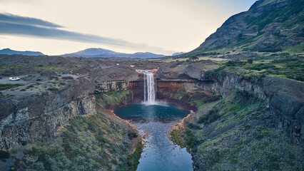 Spectacular view of Salto del Agrio waterfall – a vibrant cascade surrounded by rugged Patagonian landscapes