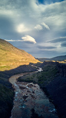 Spectacular view of Salto del Agrio waterfall – a vibrant cascade surrounded by rugged Patagonian landscapes