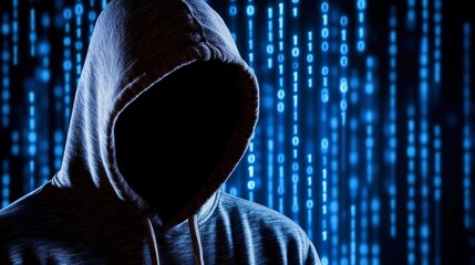 Mysterious figure in a hoodie against a backdrop of binary code, symbolizing cybersecurity threats