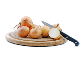 Onion on board with knife isolated on white background.  Healthy onions vegetable. 