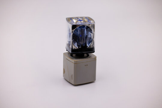 Philips flash cube on top of Kodak instamatic flashcube holder. Retro photographic film camera lighting equipment isolated on white background. Old fashioned photo technology.