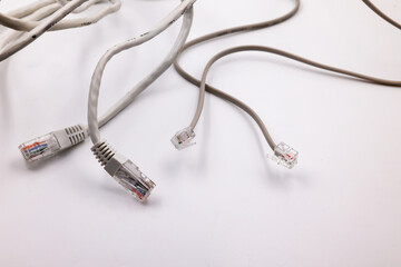 Telephone cables with crimp ends connectors isolated on white background. Retro telephonic equipment