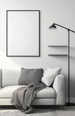 A modern living room with a light grey sofa, a black floor lamp, and a shelf on the right side of a picture frame. The poster frame on the wall is blank. 