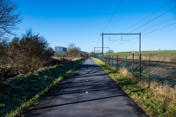 The F212 fast cycling lane or fietssnelweg, a double asphalt lane along the railway track in Zellik, Asse, Belgium