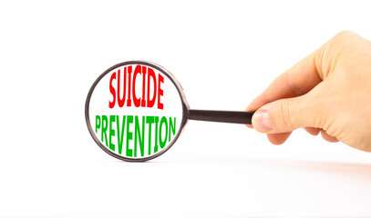 Suicide prevention symbol. Concept words Suicide prevention on beautiful magnifying glass....
