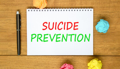 Suicide prevention symbol. Concept words Suicide prevention on beautiful white note. Beautiful...