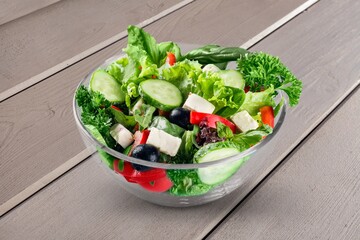 Tasty healthy fresh salad bowl with ingredients.