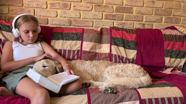 Cudding her dog reading a book