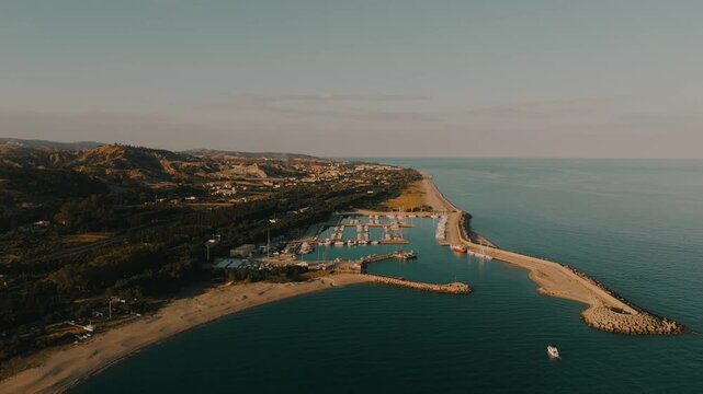Aerial View of the port at Southern Italian Coastal Town Roccella Ionica at Sunset