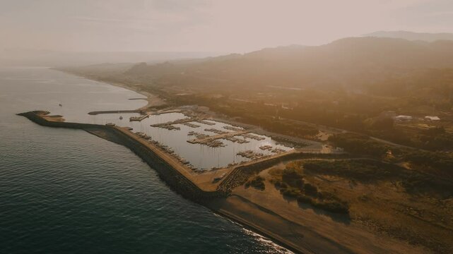 Aerial View of the port at Southern Italian Coastal Town Roccella Ionica at Sunset
