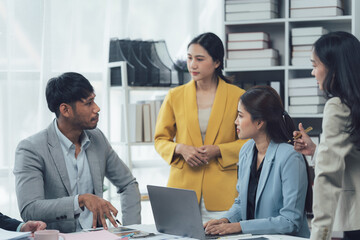 Business Meeting: A diverse team of professionals engaged in a productive discussion around a conference table, showcasing collaboration, communication, and problem-solving in a modern office setting.