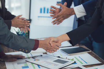 Handshake Deal: A close-up shot of a handshake between two business professionals, symbolizing a successful agreement and a partnership formed.