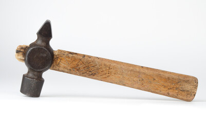 Vintage hammer on a clean white surface