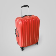 Colored travelling suitcase on light background