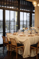 stylish details of a decorated festive table in a restaurant with a blurred background