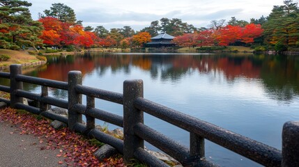 Serene autumn landscape with vibrant foliage reflecting in a tranquil pond near a traditional pavilion