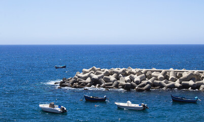 Beautiful view of the ocean and boats on a summer day. Funchal. Portugal.