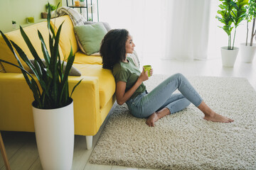 Full size profile photo of pretty young woman hold coffee inspiration pastime living room apartment...