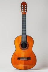 Obraz premium A guitar placed on a white background, symbolizing music as a personal passion and an enjoyable hobby to explore.