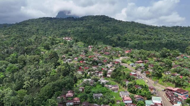 Sao Tome and Principe - Aerial View of Angolares and Beach. Coastal Town Surrounded by Lush Green Hills and Pristine Shoreline.