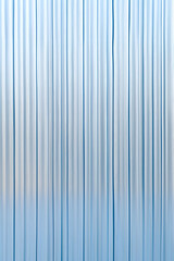 Obraz premium Abstract background with reeded ribbed glass effect texture
