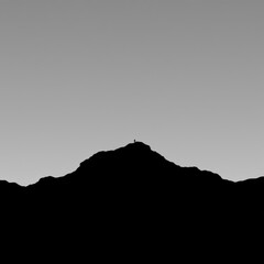 A black and white silhouette of a city skyline with reflections on water against a white background silhouetted skyline cityscape architecture illustration building city vector