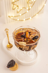 Dried fruit drink typically made in the month of Ramadan. 
It is used to break fasting after Maghrib 
Traditionally, dried apricot, prunes, raisins, figs and dates used in this drink called Khoshaf 