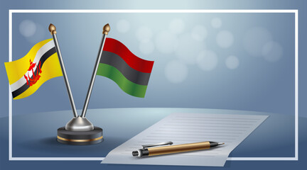 Brunei and African American National flags on small table with bokeh background, cooperative relationship