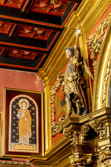 Obraz premium Maricel Palace, Sitges, Catalonia, Spain. Statue newt to the fireplace and icon