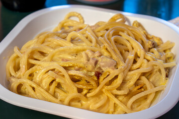 Carbonara pasta, spaghetti with pancetta, egg, hard parmesan cheese and cream sauce. Traditional italian cuisine. Pasta alla carbonara