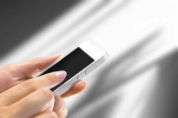business person using smart phone in office