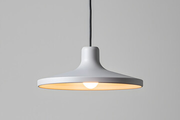 A modern grey pendant light hanging isolated on grey background