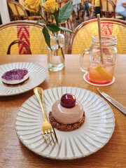 Elegant Berry Dessert With Gold Fork In Cafe