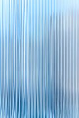 Obraz premium Abstract background with reeded ribbed glass effect texture
