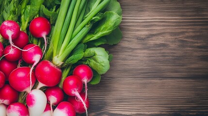 Freshly harvested radishes and green onions on a wooden surface, with ample copy space for text