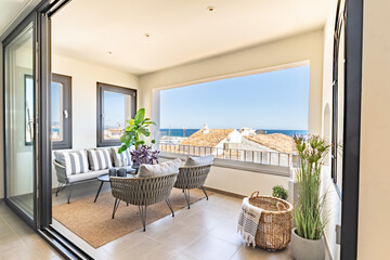an image of luxury mediterranean apartment real estate balcony terrace overlooking the portside town of Puerto Banus 