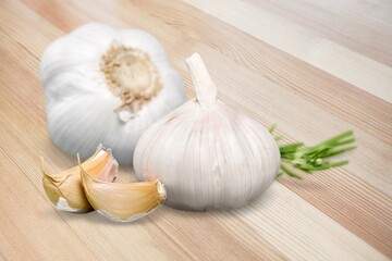 Garlic cloves on wooden table.