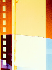 Obraz premium old brown film frame, blank cinema film strip with retro vintage look, film noise texture and background, old film frame from analog retro film roll, photo texture with grain and scratches