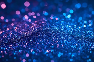Magical glowing bokeh lights creating dreamy abstract background in vibrant blue and purple colors with blurred sparkles and defocused particles.