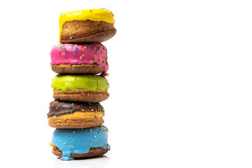 Colorful donuts on white background with copy space for text.