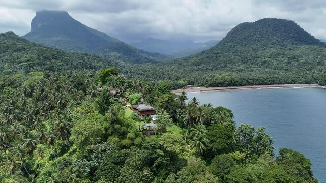 Sao Tome and Principe - Angra Toldo Praia and Pico Maria Fernandes. Scenic Small Town Surrounded by Tropical Rainforest and Majestic Mountains.