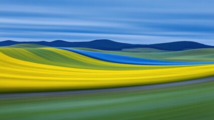 Obraz premium abstract landscape with flowing yellow, green, and blue fields under a softly blurred sky wallpaper