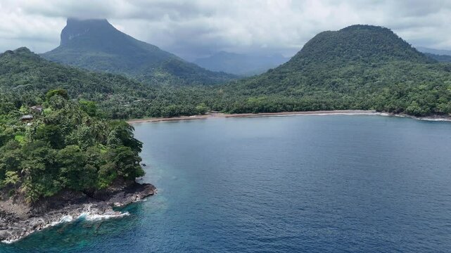 Sao Tome and Principe - Angra Toldo Praia and Pico Maria Fernandes. Scenic Small Town Surrounded by Tropical Rainforest and Majestic Mountains.